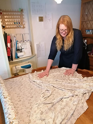 Cassie working in her sewing room